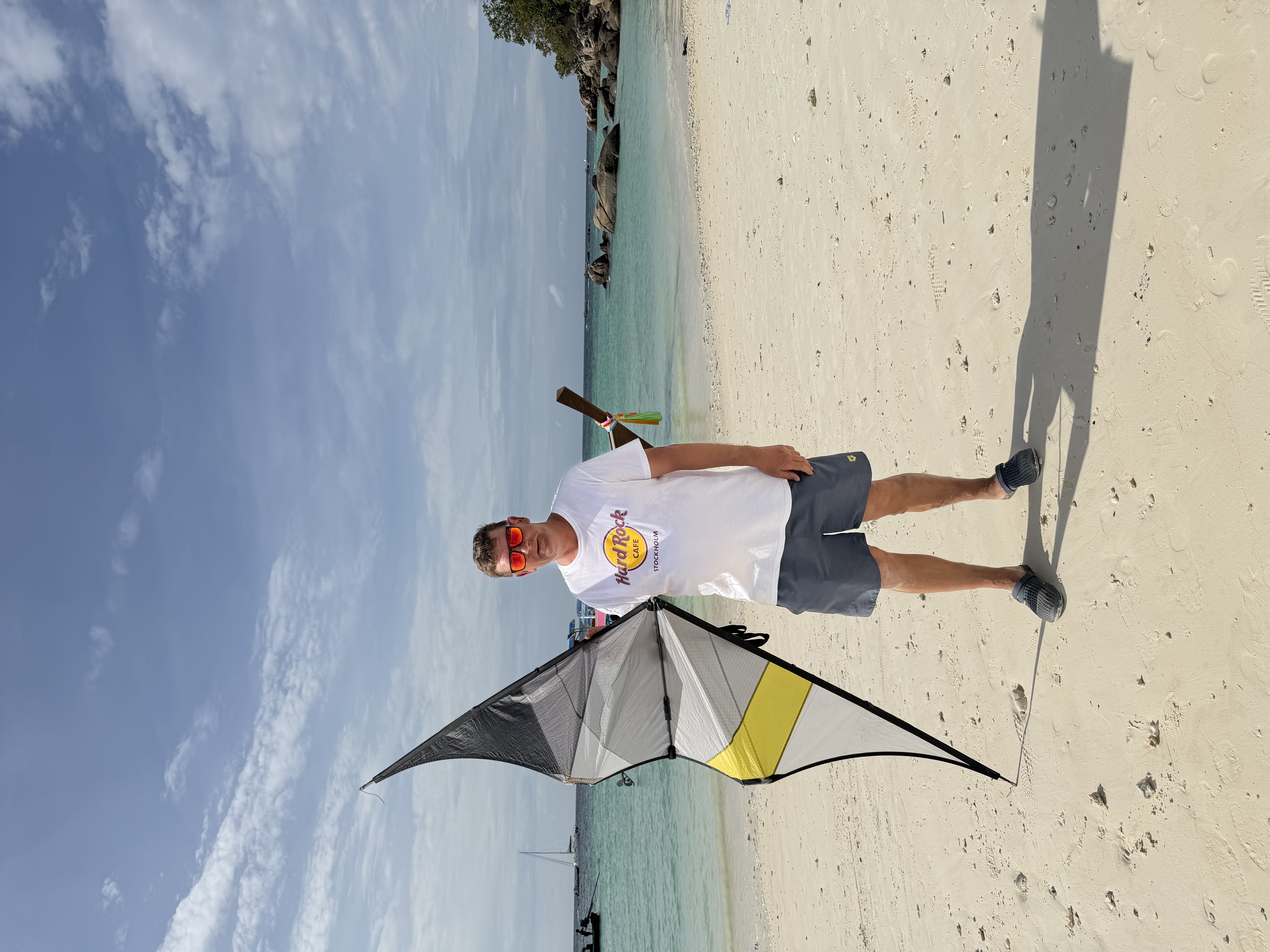 Andrés on a beach with his sport kite